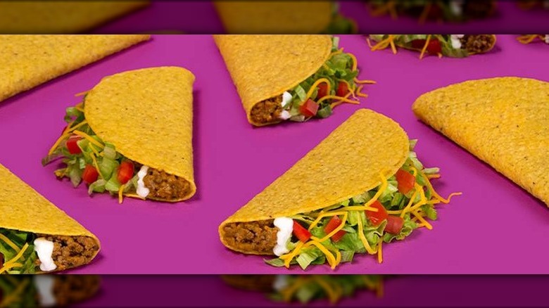 Taco Bell tacos agaisnt a purple background