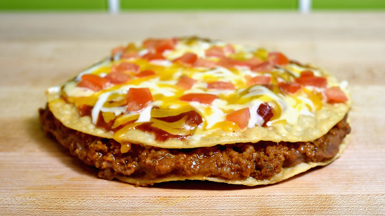 Taco Bell Mexican Pizza on wooden surface