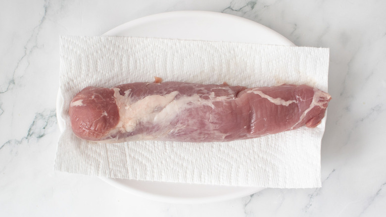 Pork tenderloin on paper towels