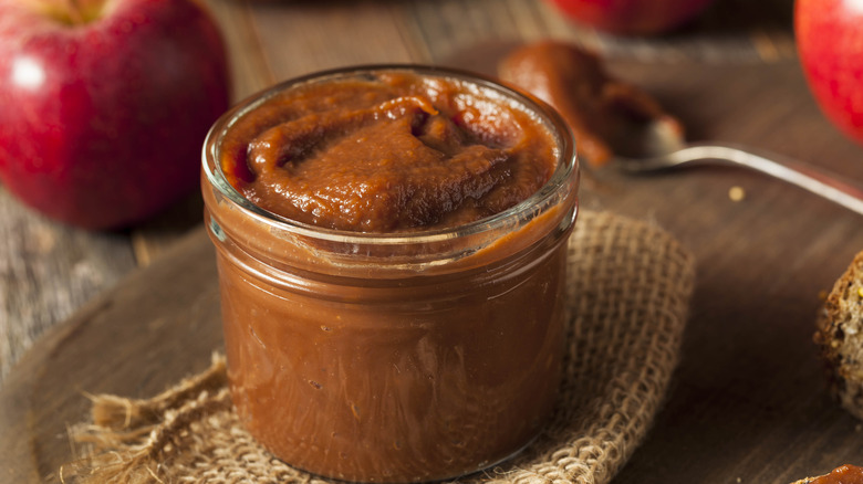 apple butter jar with red apples