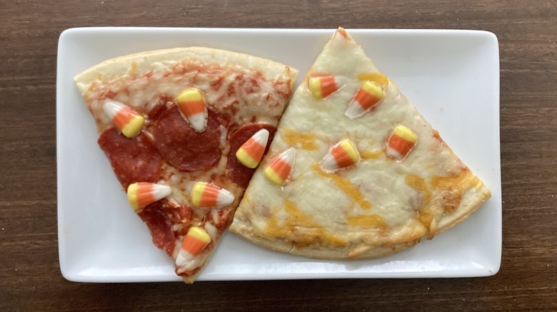 Two Tombstone candy corn pizza slices on a plate
