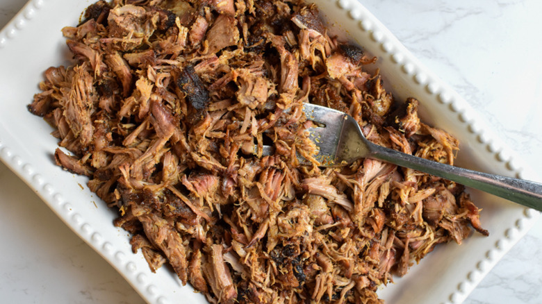 smoked pulled pork in white dish 