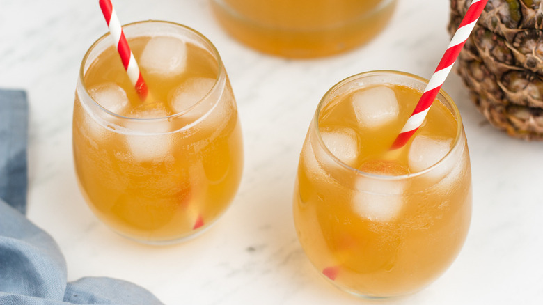 glasses of tepache with straws