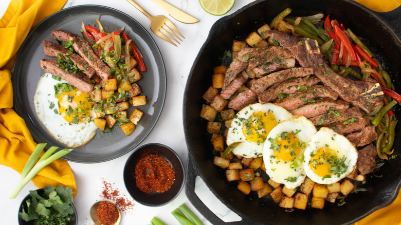 skillet and plate with tex-mex steak & eggs