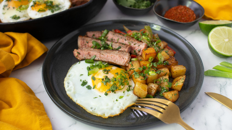 plate with tex-mex steak and eggs