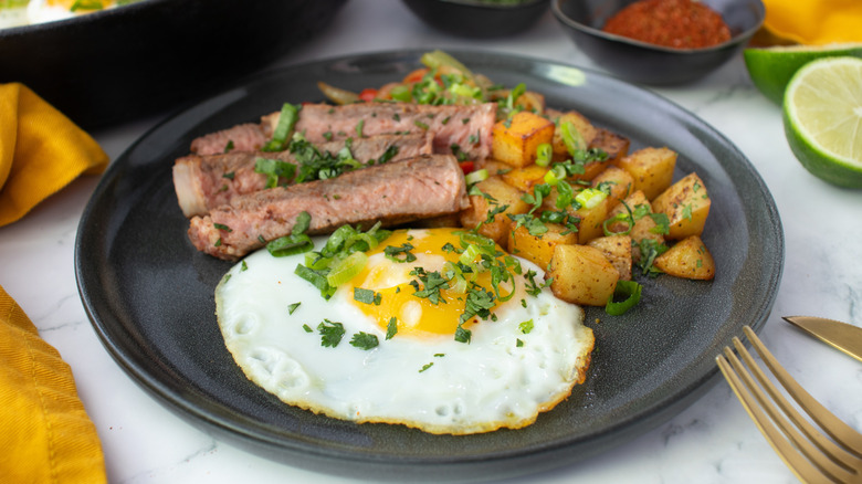 tex-mex steak and eggs on plate