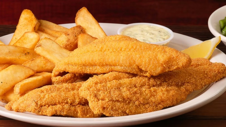 The fried catfish meal at Texas Roadhouse with sauce and fries