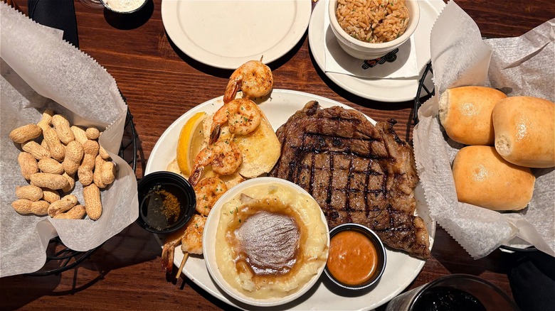 A plate of steak, potatoes, and sides at Texas Roadhouse.