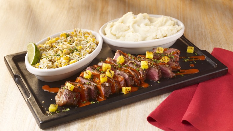 grilled meat with sides from TGI Fridays new menu