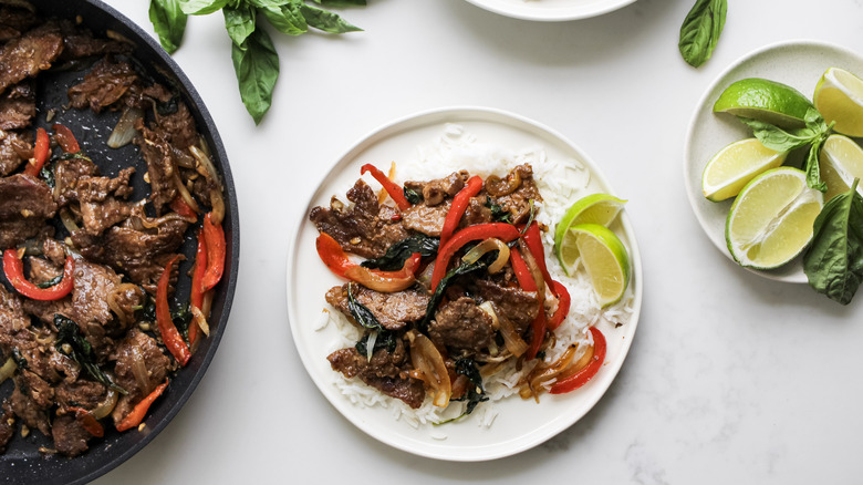 Thai basil beef over rice with lime