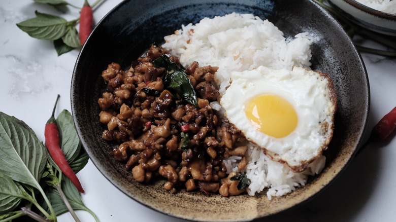 basil chicken in rice bowl