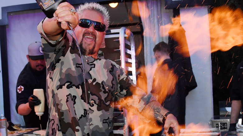 Guy Fieri cooking with fire