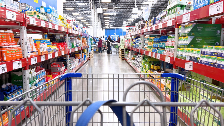 View looking ahead over a shopping cart in a Sam's Club aisle