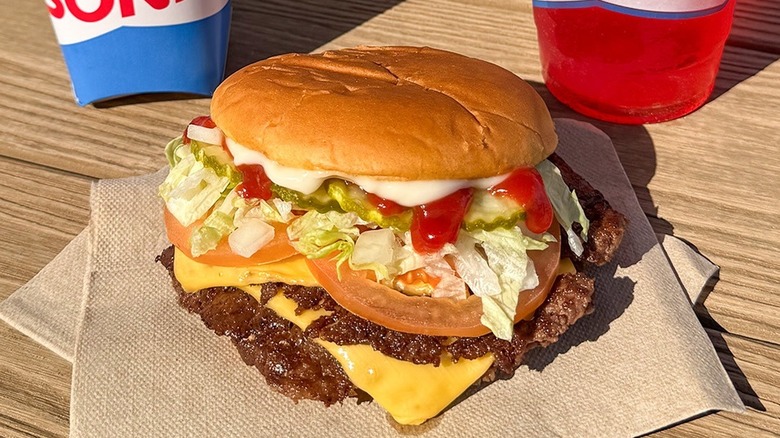 All-American Smasher from Sonic atop a paper napkin on a wooden table