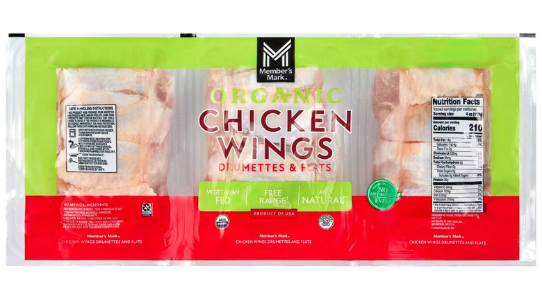 Plastic package with three portions of raw chicken wings.