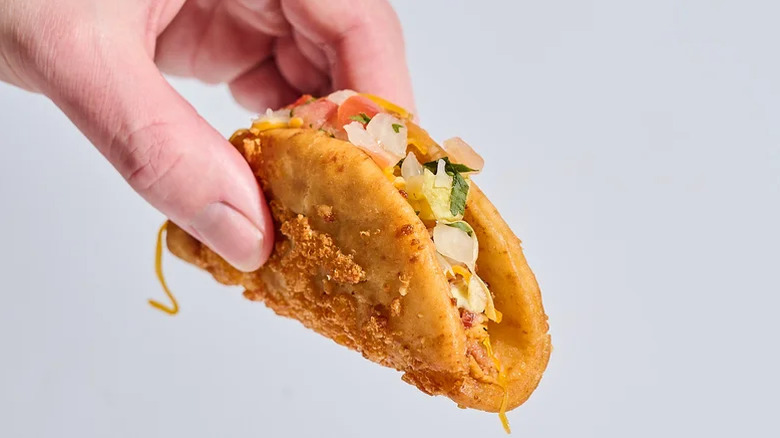 Taco Bell's Chicken Bacon Ranch Street Chalupa in hand