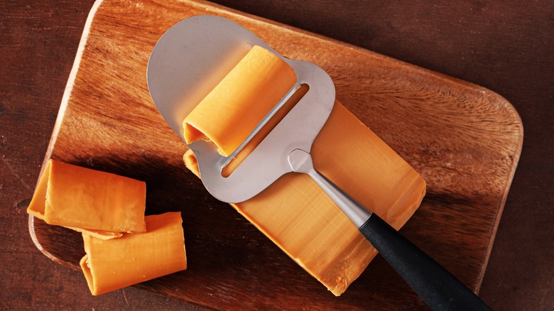 Norwegian brunost cheese with slicer