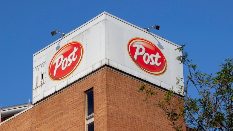 Post building tower with sign