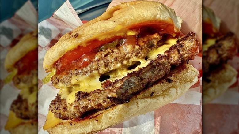 a double cheeseburger with ketchup
