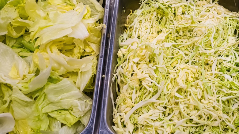 Iceberg lettuces in bins