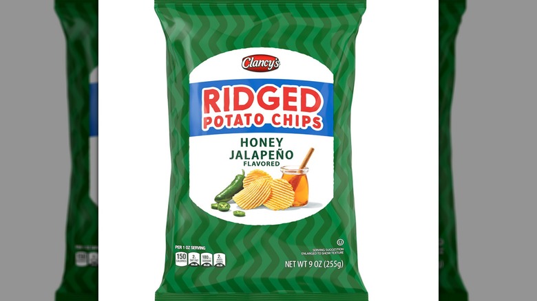 Green bag of Clancy's ridged potato chips Honey Jalapeño flavored