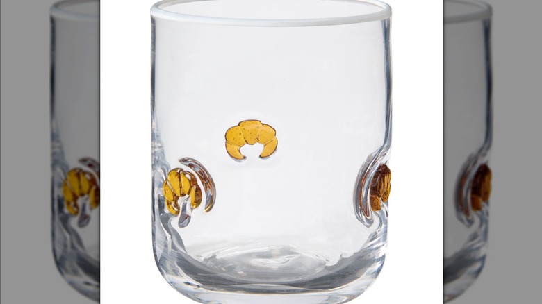 Clear glass cup with small croissant icons