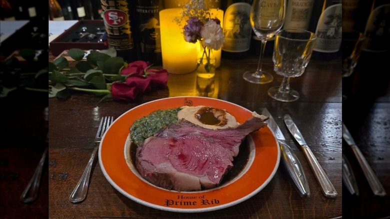 Prime rib in au jus with side of mashed potatoes on plate at House of Prime Rib restaurant