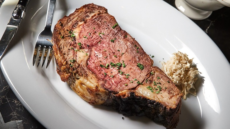 Prime rib topped with chives and served with grated horseradish at The Prime Rib restaurant in Baltimore