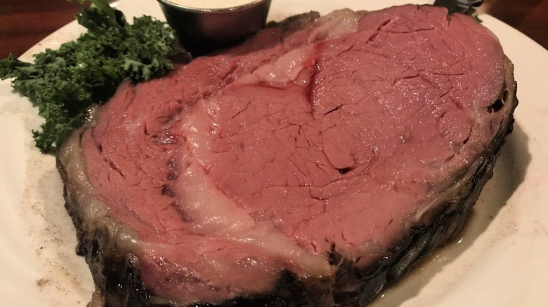 The prime rib at Tropical Acres Steak House with side of garnish and sauce