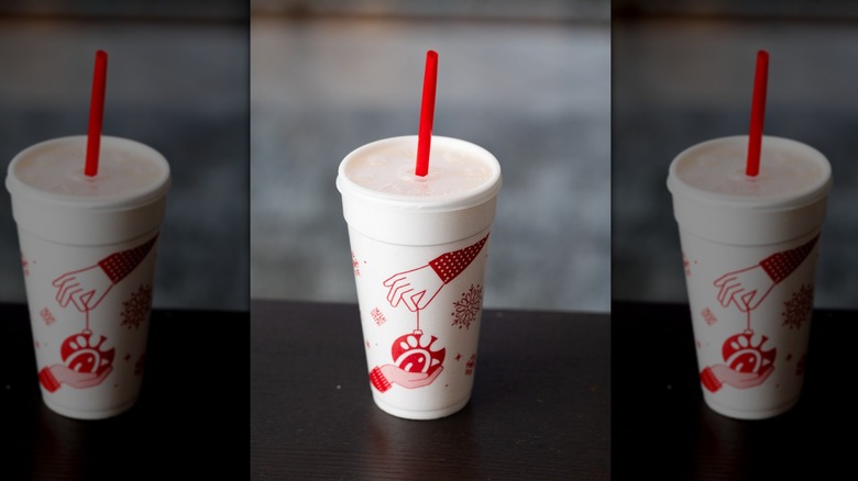A Chick-fil-A takeout beverage is presented in a seasonal cup.