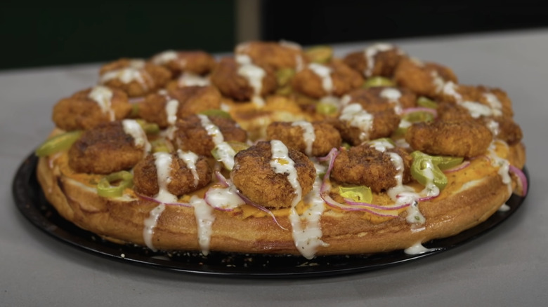 Giant pizza bagle with plant based nashville spice chicken nuggets