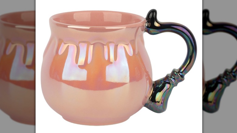 Cauldron shaped coffee mug in iridescent pink.