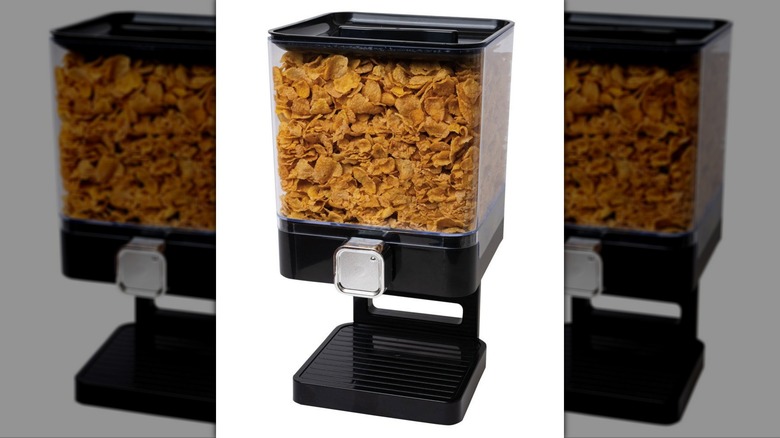 Cereal dispensing device filled with corn flakes.