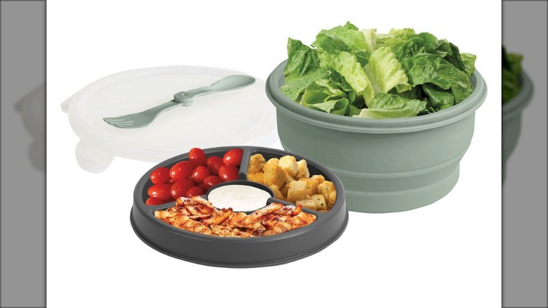 Collapsible portable food container with lettuce and other salad ingredients.