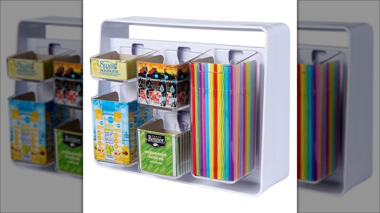 Plastic storage container with multiple compartments in different shapes and sizes.