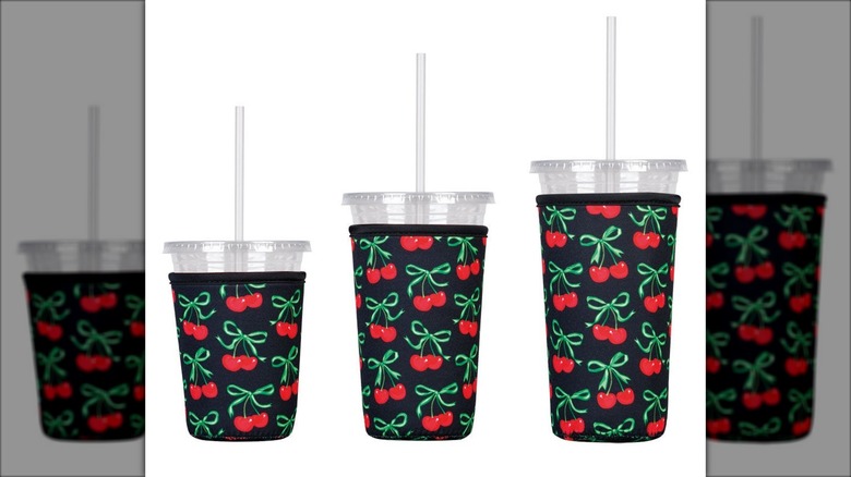 Three sizes of drink sleeves with a cherry design.