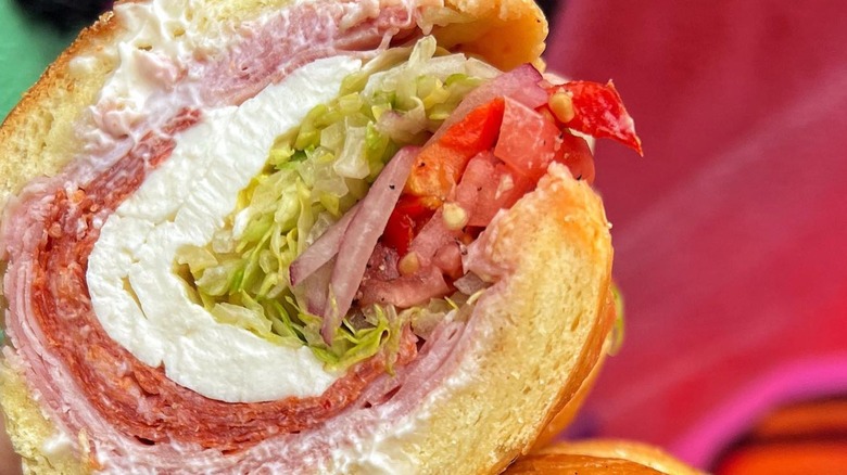 meat and cheese with lettuce and tomatoes up close