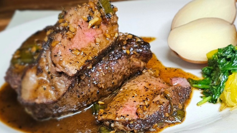 Double steak filet in sauce with vegetable sides