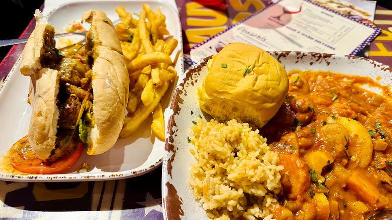Plates of po' boys, fries, rice, and stew
