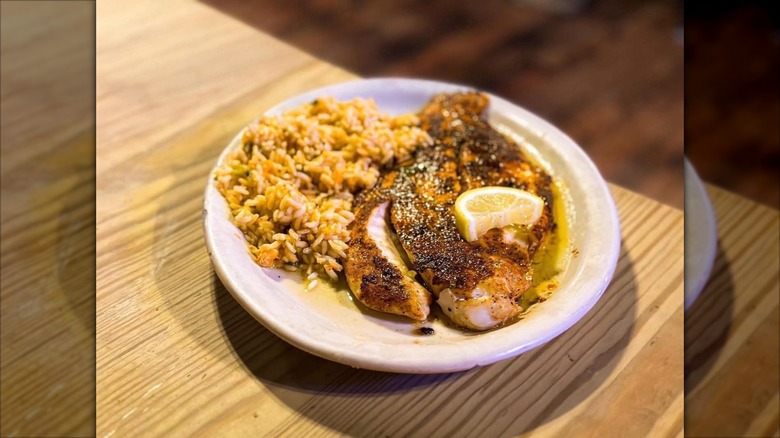 Blackened Cajun redfish with a side of rice