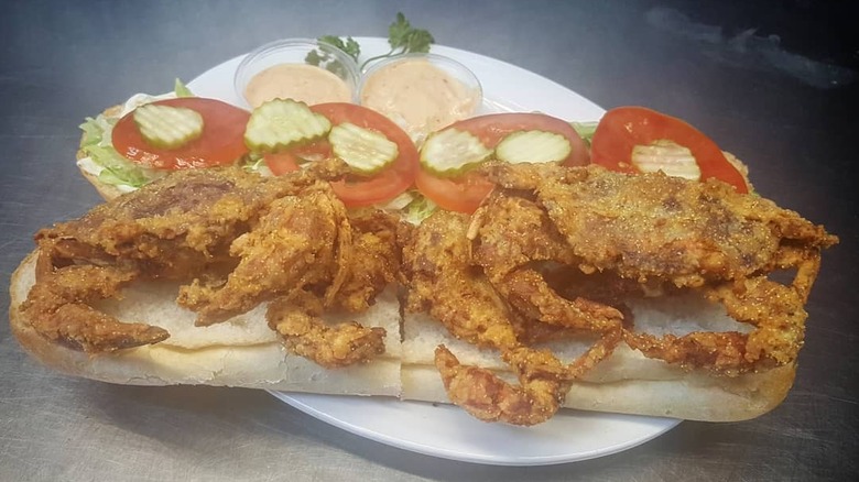 a fried crab sandwich with vegetables