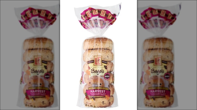 A bag of six L'oven Fresh bagels with leaf decorations.