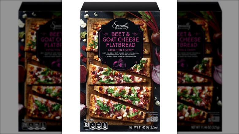 Box labeled "Beet & Goat Cheese Flatbread" with slices of pizza, feta cheese, and whole and sliced beets.
