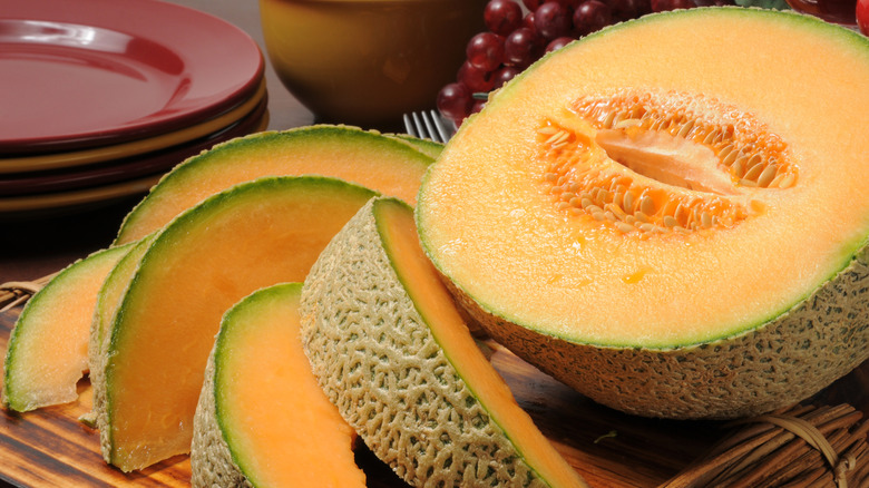 Cantaloupe slices and half-cut cantaloupe