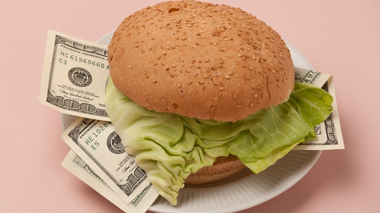 burger filled with dollar bills
