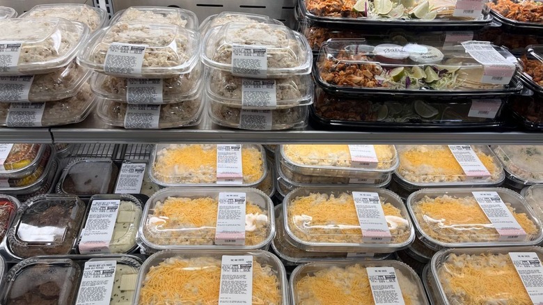 Assorted prepared foods in a refrigerated case at Costco.