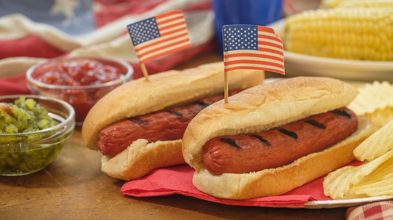 Hot dogs with toothpick American flags stuck into buns