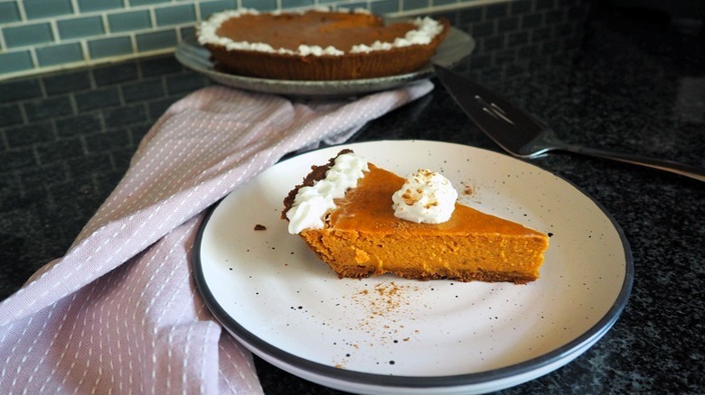 Pumpkin pie slice on plate