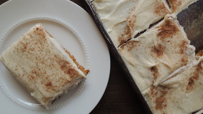 Frosted pumpkin cake on plate