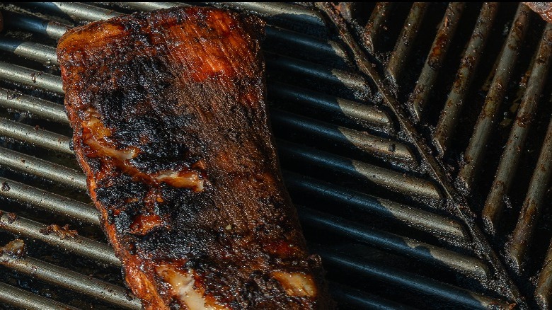 Pork ribs on grill grates